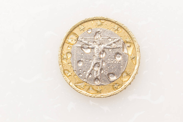 Euro coins, euros and euro cents on white background. Coins with water drops. - Photo, Image