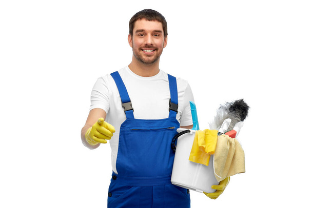 male cleaner in overall with cleaning supplies - Fotó, kép