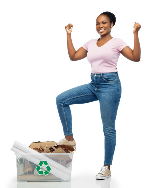 happy african american woman sorting paper waste - Zdjęcie, obraz