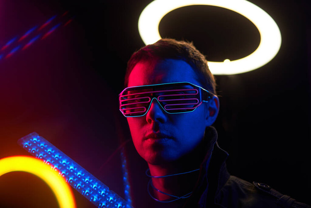 Cyberpunk style portrait of man in futuristic costume. - Photo, Image