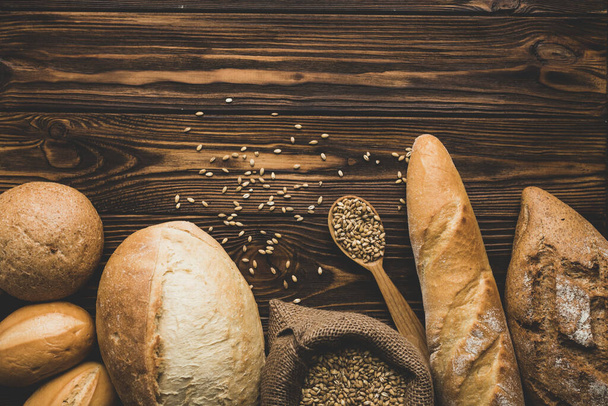 assortment bread loaves wood. Resolution and high quality beautiful photo - Фото, изображение