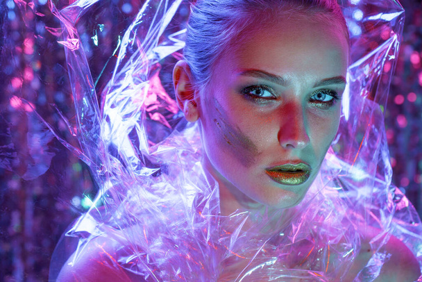 High Fashion model girl in colorful bright neon lights posing in - Foto, Imagen