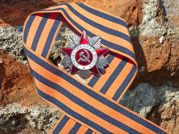 Ordem "Grande guerra Patriótica" na faixa de São Jorge. Prémios do soldado. A relíquia. Memória. 9 de Maio Dia da Vitória - Foto, Imagem