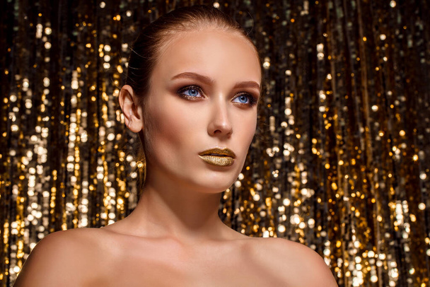 Magic Girl Portrait in Gold. Golden Makeup, close-up portrait in - Фото, изображение