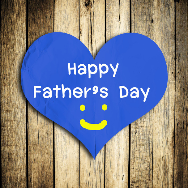Happy Father's day word on red heart shape with wooden wall - Foto, afbeelding