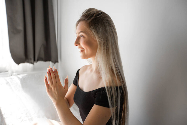 beautiful young woman doing yoga at home - Fotó, kép