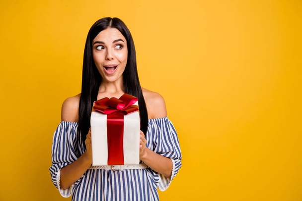 Photo of funny impressed lady wear striped clothes getting present open mouth looking empty space isolated yellow color background - Φωτογραφία, εικόνα