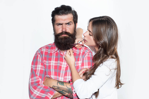 Bearded man. Barbershop concept. Hairdresser cuts beard. Barber shop haircut. Facial hair trimming. - Fotó, kép