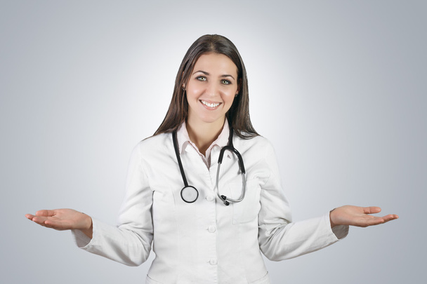 Portrait of friendly female doctor with stethoscope. - 写真・画像