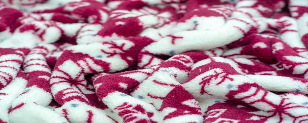 Velvet. Plush. For winter wear. Snow deer, snowflakes. Red and white tones. Silk fabric with soft, smooth and thick pile. Rich Silk Clot - Photo, Image