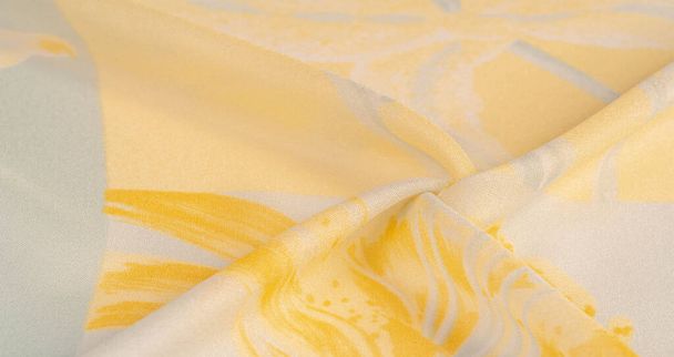 Tissu en soie, fleurs jaunes sur fond blanc. ce tissu délicat aux couleurs pastel évoquera les ponts et la fantaisie. Texture, motif de fond, - Photo, image