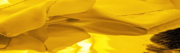 yellow silk fabric, beautiful smooth elegant wavy yellow satin silk luxury fabric, abstract design. background texture, pattern - Photo, Image