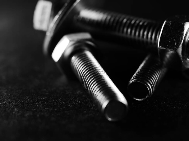 a closeup shot of metal screw threads isolated on the black background - Φωτογραφία, εικόνα