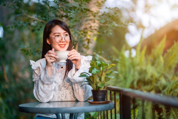 Happy of asian people business female hold a coffee cup mug casual Relaxed in the morning in coffee shop,Business Lifestyle concept - Photo, Image