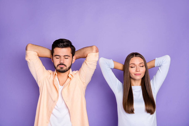 Top above high angle view of brown haired man and woman lie sleep rest relax time isolated on violet color background - 写真・画像