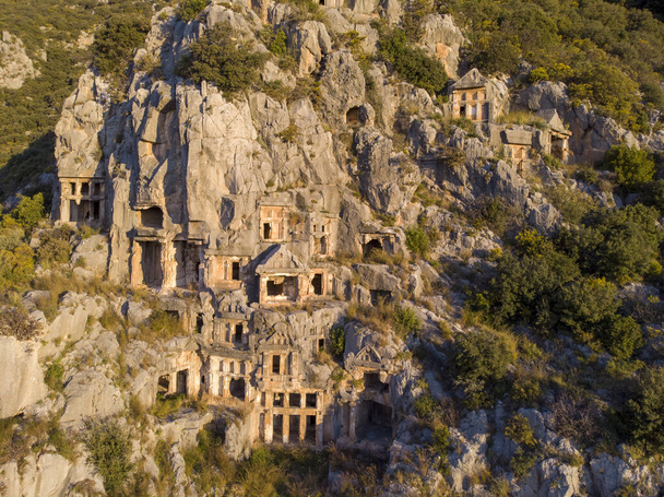 Aerial Shot Archeological remains of the Lycian rock cut tombs in Myra, Turkey - Photo, Image