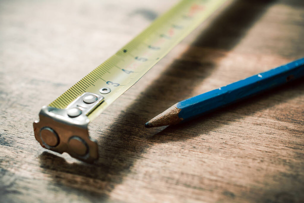 Pencil And Measuring Tape On An Vintage Wooden Table - Foto, Imagem