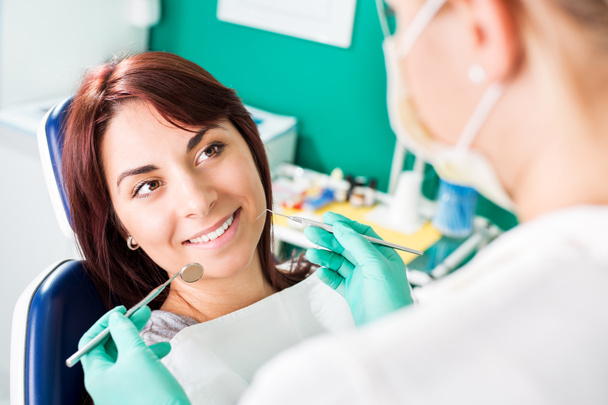 Smiling woman at dentist - Photo, Image