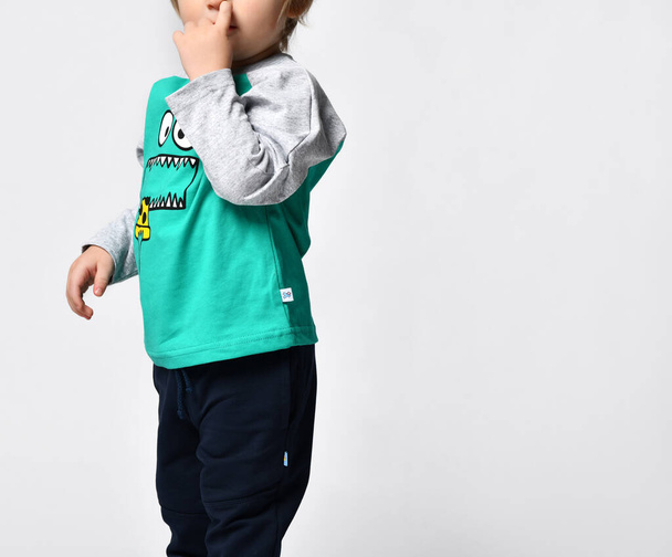 Little preschool toddler boy showing growth up gesture portrait - Фото, изображение