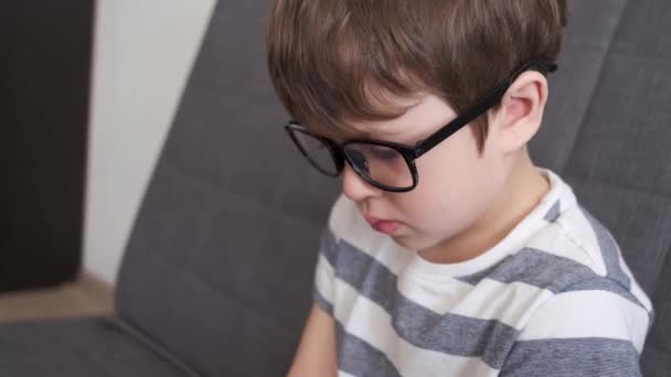 4k. little cute caucasian boy in glasses close up. Side view.  - Footage, Video