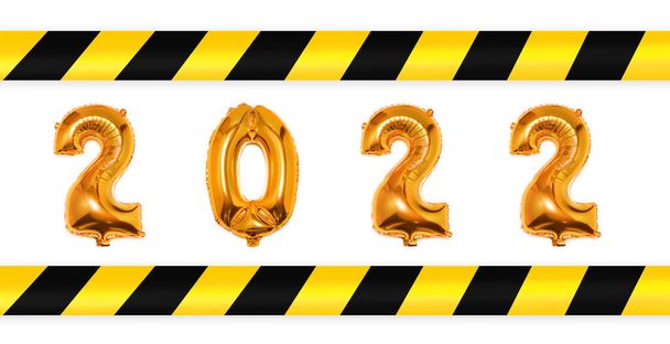 2021 gold balloons with yellow and white warning tapes white background. Social distance during covid 19 coronavirus quarantine. Lockdown. Safe New Year and Christmas Celebration. - Photo, Image