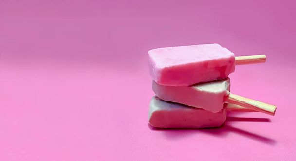 handmade ice lolly on pink background, copy space - Photo, Image