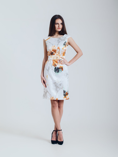 Girl in beautiful dress. Catalogue shoot. Isolated on white back - Photo, Image