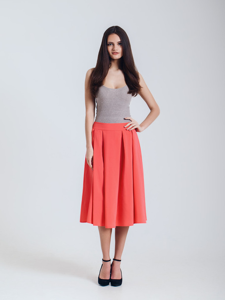 Girl in beautiful skirt. red - Zdjęcie, obraz