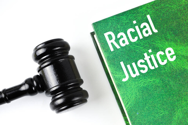 Judge gavel and green book written with RACIAL JUSTICE - Photo, Image