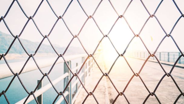 Chainlink fence. Wire fence. Metal net. Wire mesh. Metal grater grille background. - 写真・画像
