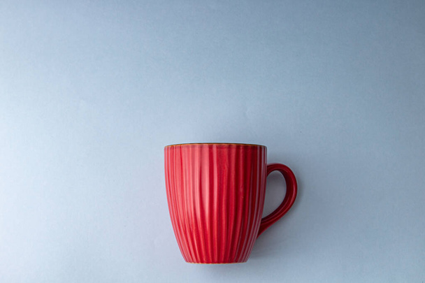 A top view of a cup of hot coffee isolated on a gray background - Photo, image
