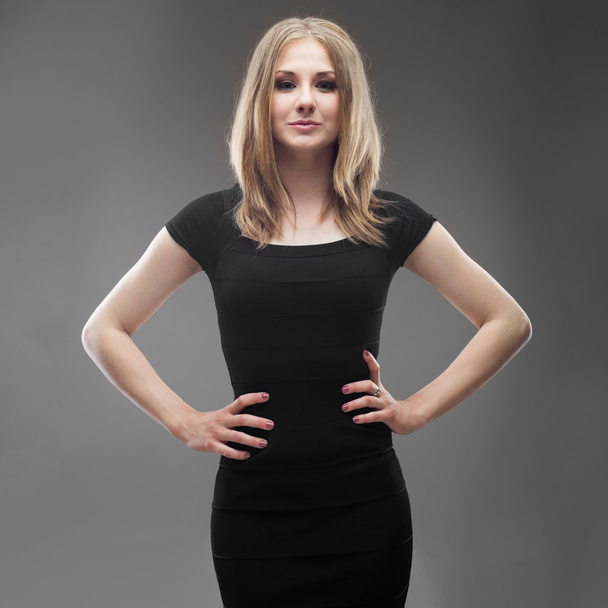 portrait of a young beautiful woman in black dress isolated - Photo, Image