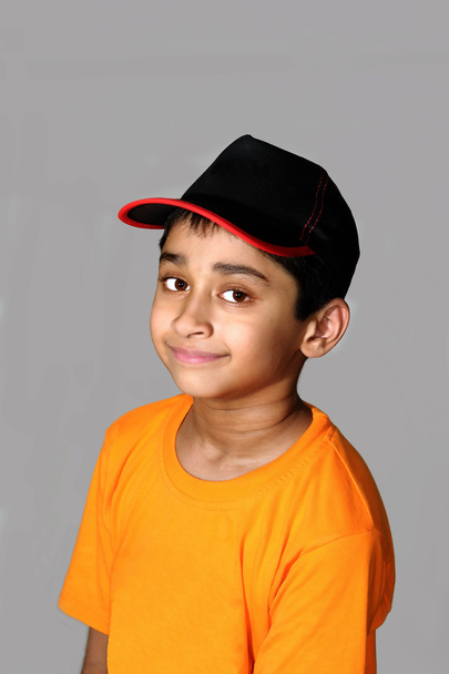 An happy and handsome Indian kid smiling before the camera - Foto, Bild