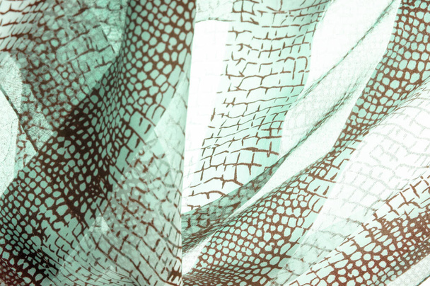 Textura. Antecedentes Plantilla. tela de seda de piel de pitón, patrón marrón, tema africano, fulvous, lurid, marrón grisáceo - Foto, imagen