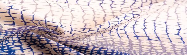 Textuur. Achtergrond. Sjabloon. zijden stof als python huid, marine blauw patroon, Afrikaans thema - Foto, afbeelding