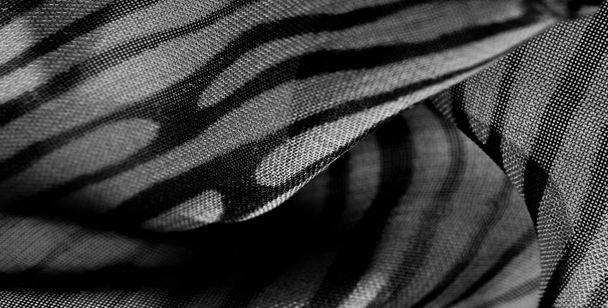Zwart wit zijden stofpatroon. Deze medium-gewicht rayon stof heeft een mooie glans met lichte kleurvariaties. textuur, achtergrond, patroon,  - Foto, afbeelding
