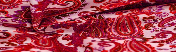 Paisley red pattern on a white background. The pattern is sometimes referred to as "Persian pickles" by American traditionalists, especially patchwork craftsmen, or "Welsh pears" in Wales - Photo, Image