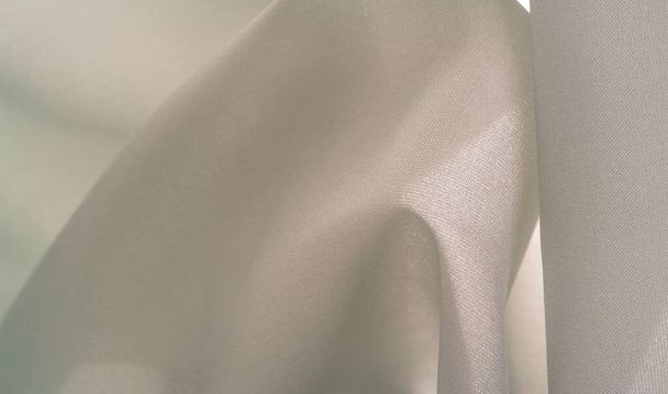 Seda de creme macio de aço em uma combinação de algodão e seda, com um padrão de fundo de tons de creme claro pálido, sépia bege. Textura de fundo - Foto, Imagem