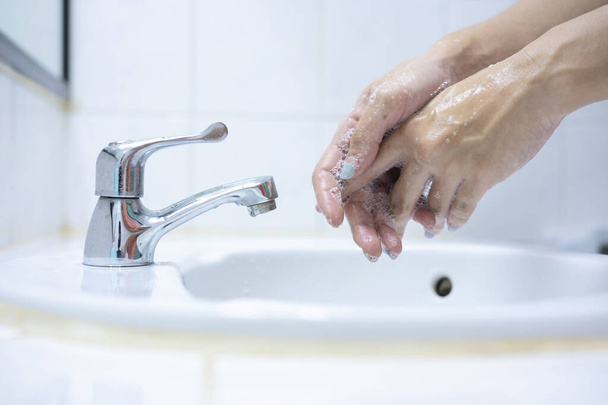 Wash your hands, soap your hands. Women's hands are washed with soap. Hand hygiene, skin care, disinfection. Soaping your hands with antibacterial soap - Φωτογραφία, εικόνα