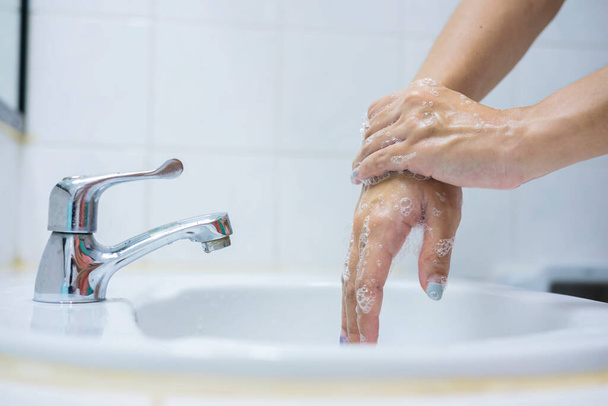 Wash your hands, soap your hands. Women's hands are washed with soap. Hand hygiene, skin care, disinfection. Soaping your hands with antibacterial soap - Fotografie, Obrázek