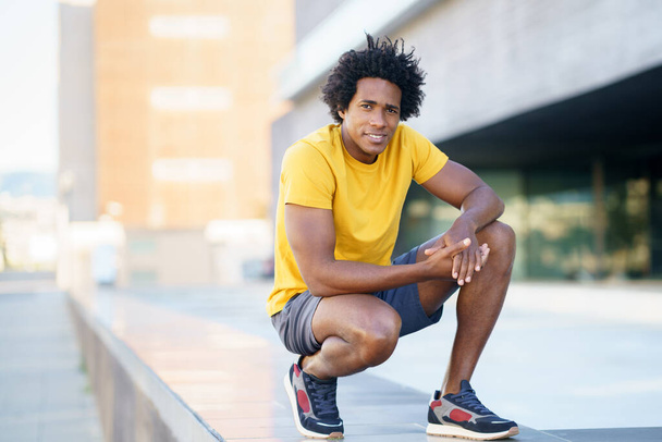 Black man with afro hair taking a break after workout. - Photo, Image