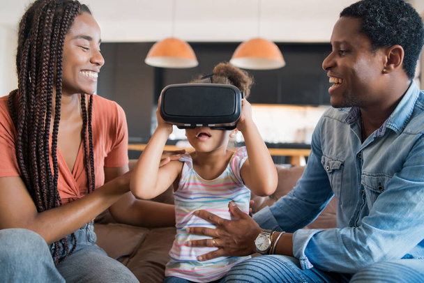 Family playing video games with VR glasses. - Foto, immagini