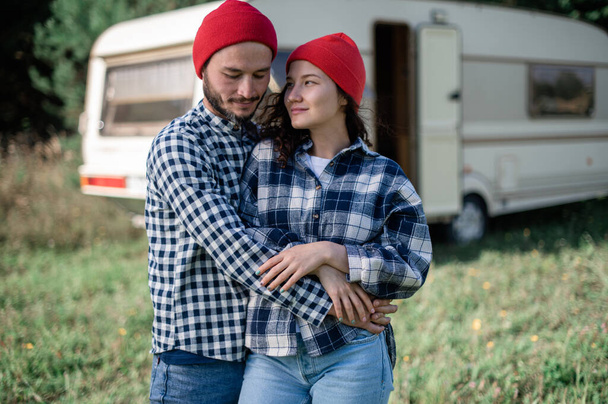 Romantic couple spending time together near trailer home - Photo, Image