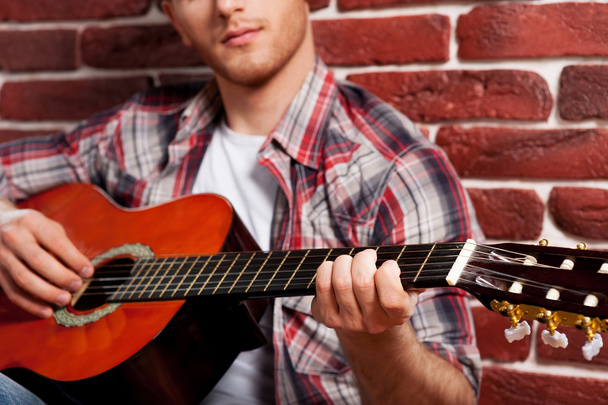 Man playing acoustic guitar - Photo, image