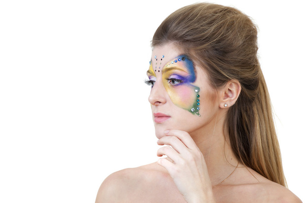 Portrait of beautiful girl with body art butterfly on her face - Foto, imagen
