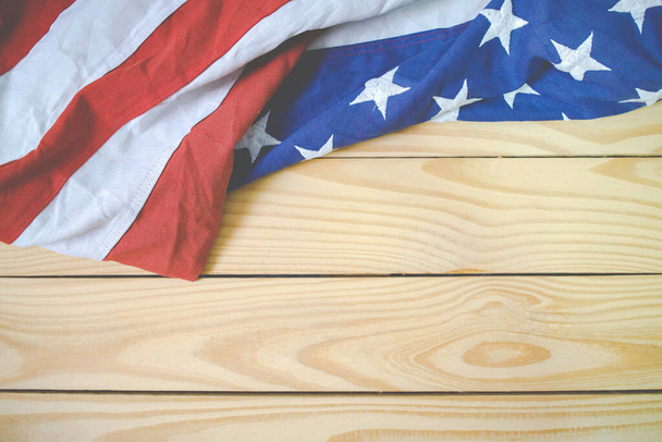 Close up of waving national usa american flag. The flag of the United Sates of America on a grey plank background with memorial day. - Photo, image