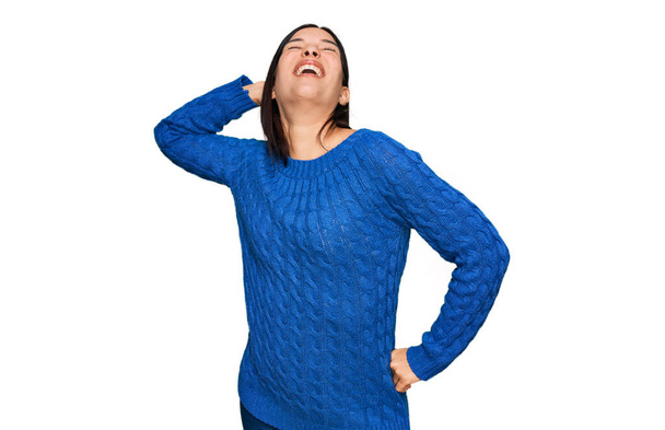 Young hispanic woman wearing casual clothes stretching back, tired and relaxed, sleepy and yawning for early morning  - Foto, Imagen