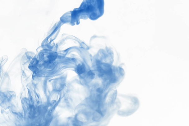 Puffs of paint in water. The dissolution of dye in water. Water pollution. Concept art creativity. - Foto, Imagem
