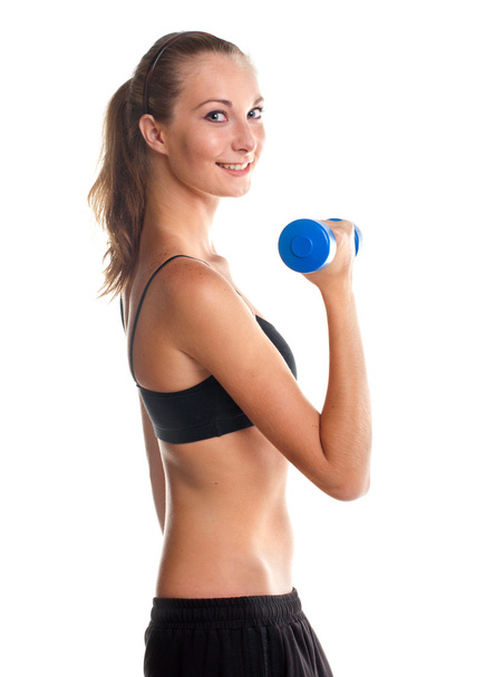Smiling young girl doing fitness exercises - Foto, Bild