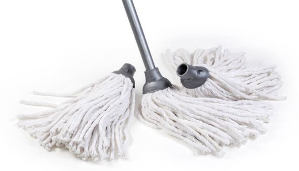 Classic mop with head in the form of cotton yarn rope segments bundle and metal tubular handle, two additional replaceable working heads with threaded connection on a white background - Photo, Image
